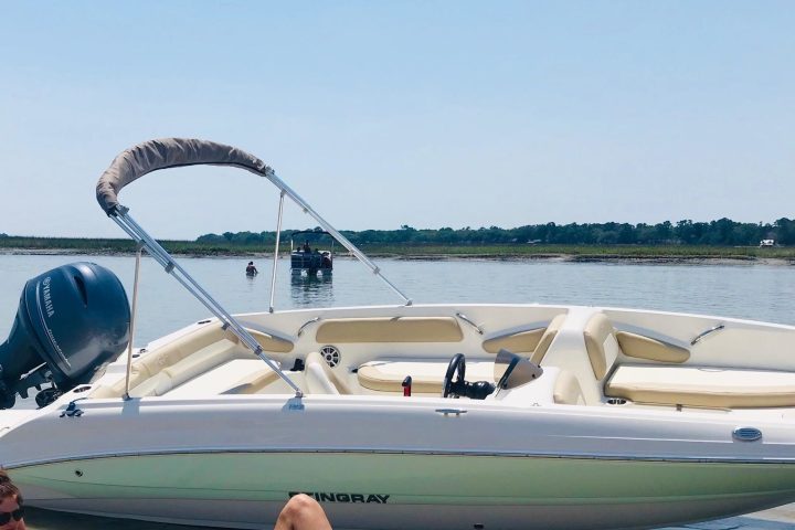 a couple of people that are sitting on a boat in the water