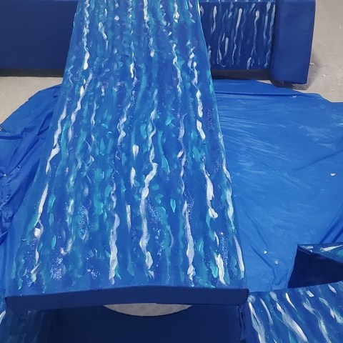 a bed with a blue umbrella