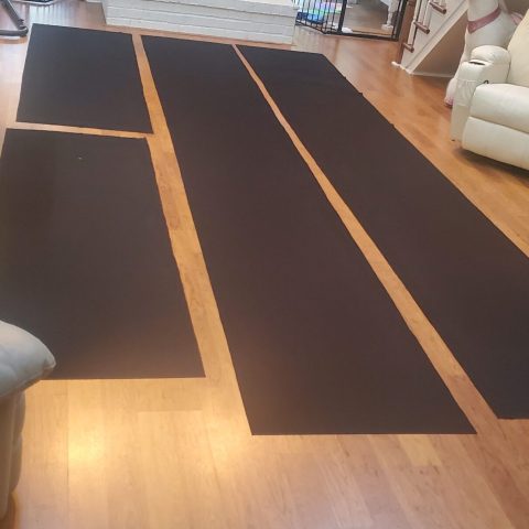 a view of a living room with a wooden floor