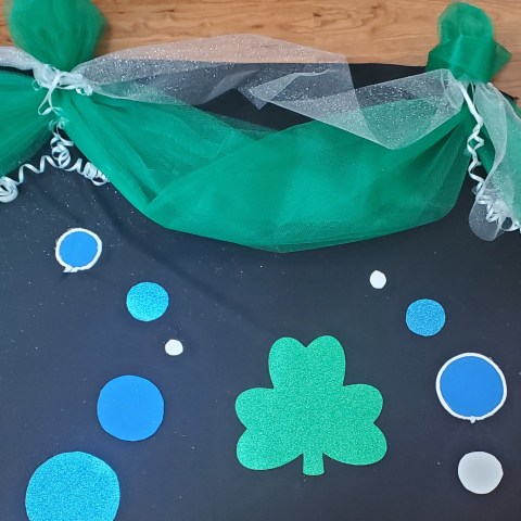 a blue and green cake on a table